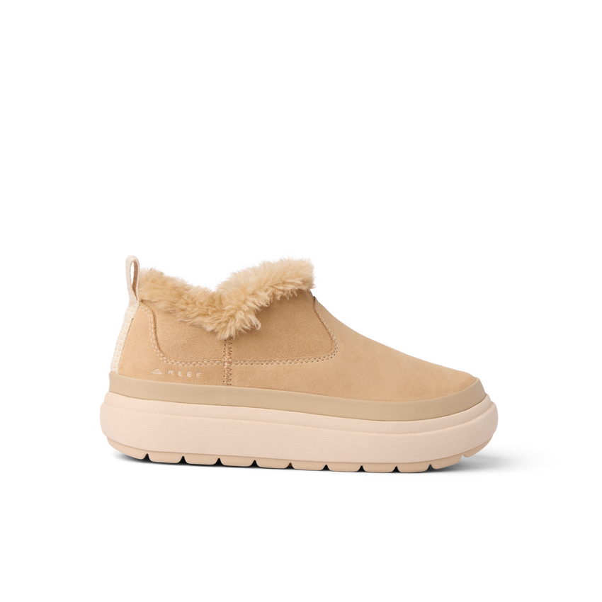 Side view of Weekend Olivia shoe in tan with water-resistant nubuck, plush faux fur lining, and lightweight sole facing right.