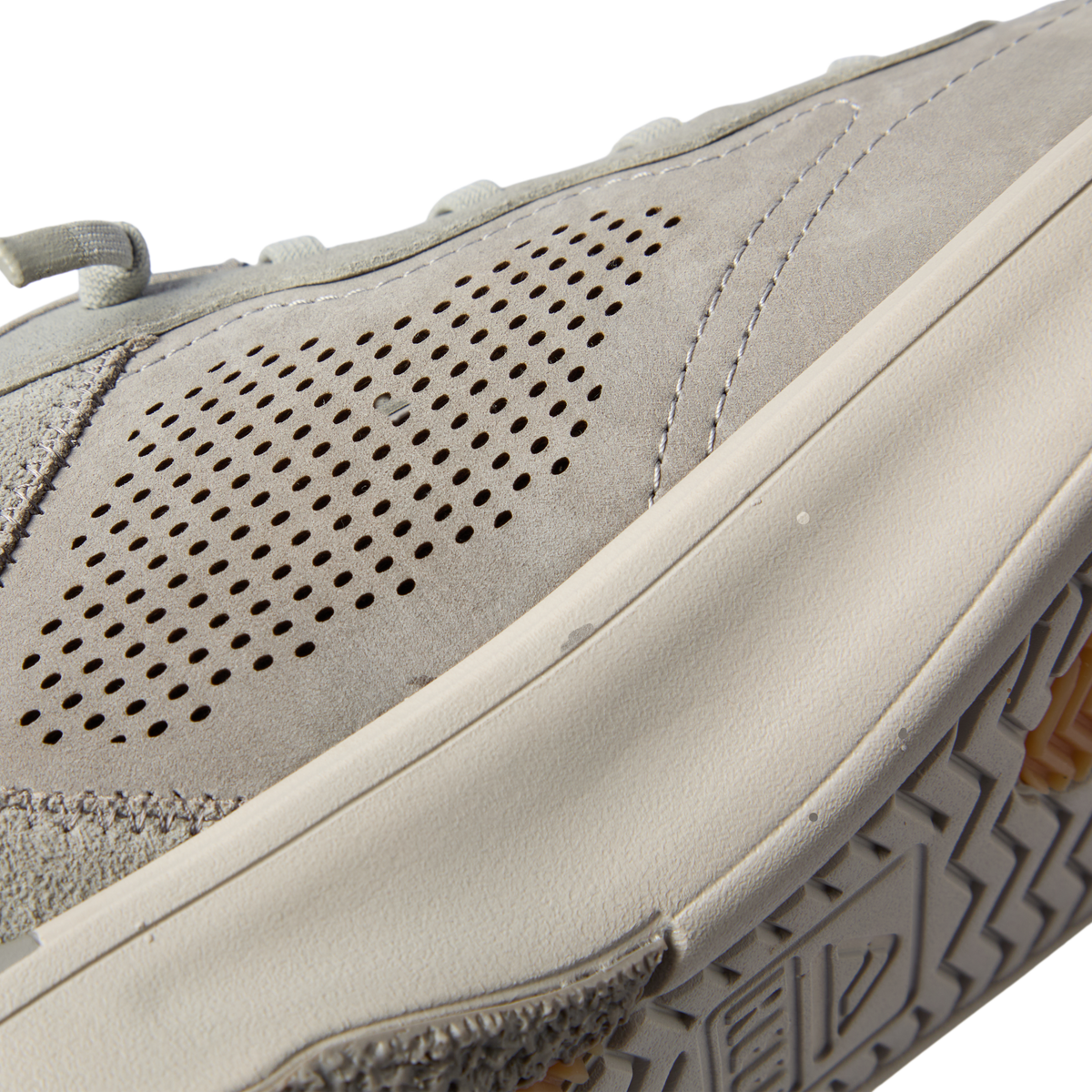 Del Mar Leather grey shoe facing right, close-up of perforated suede and leather upper with cushioned sole