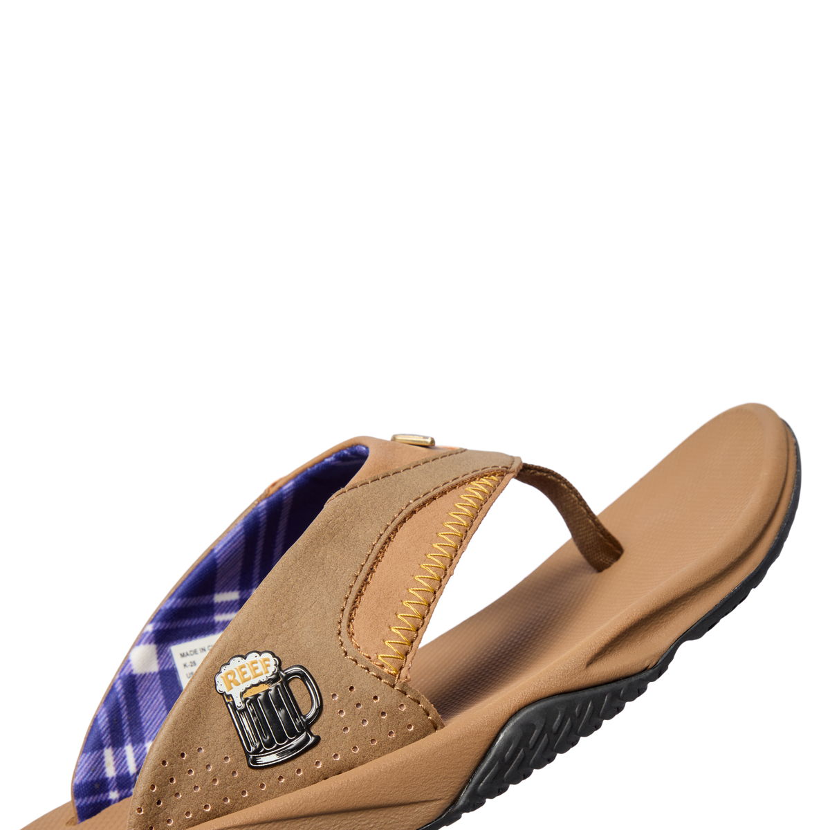 Fanning right-facing water-friendly sandal with arch support, soft cushioning, and bottle opener feature in brown tones
