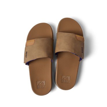 Top view of a pair of brown Fanning Slide sandals with water-friendly soles and arch support for beach comfort