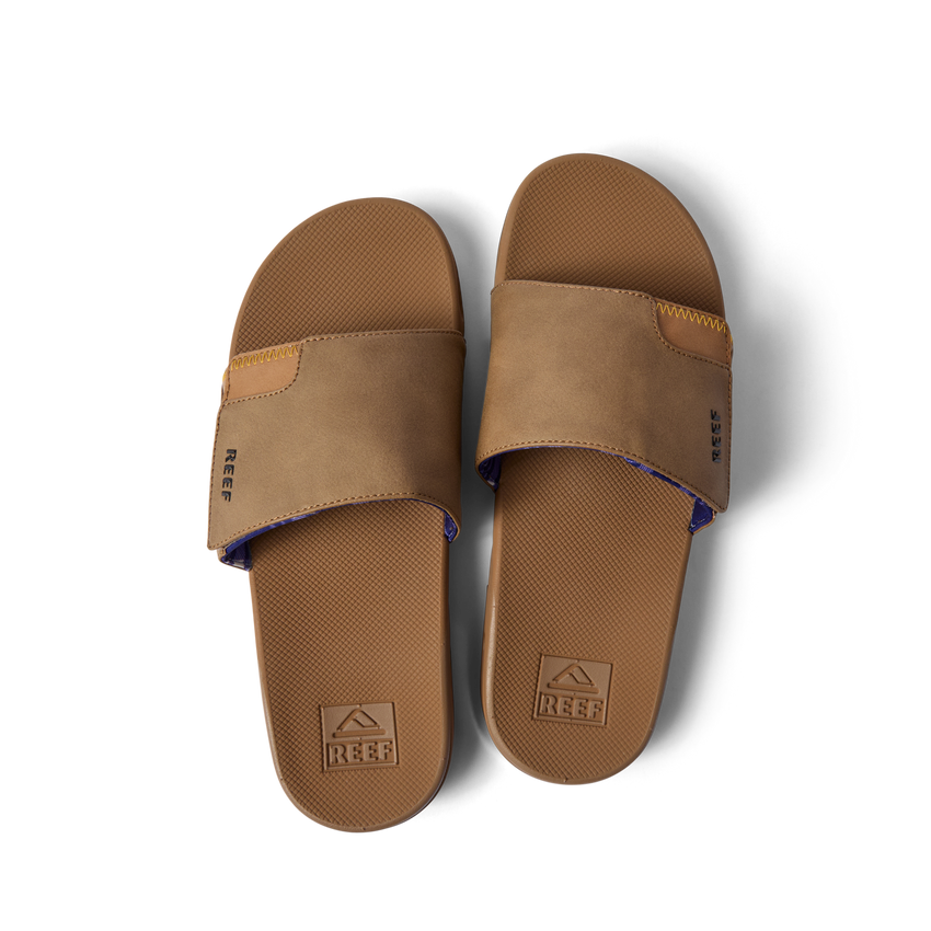 Top view of a pair of brown Fanning Slide sandals with water-friendly soles and arch support for beach comfort