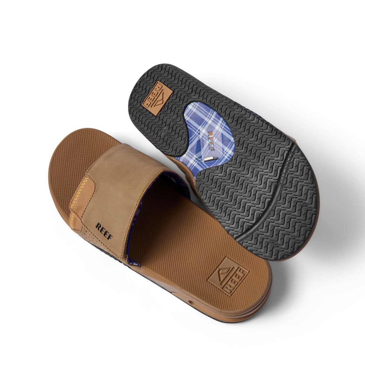 Pair of Fanning Slide sandals showing top of left and sole of right, water friendly, arch support, comfortable beach footwear.