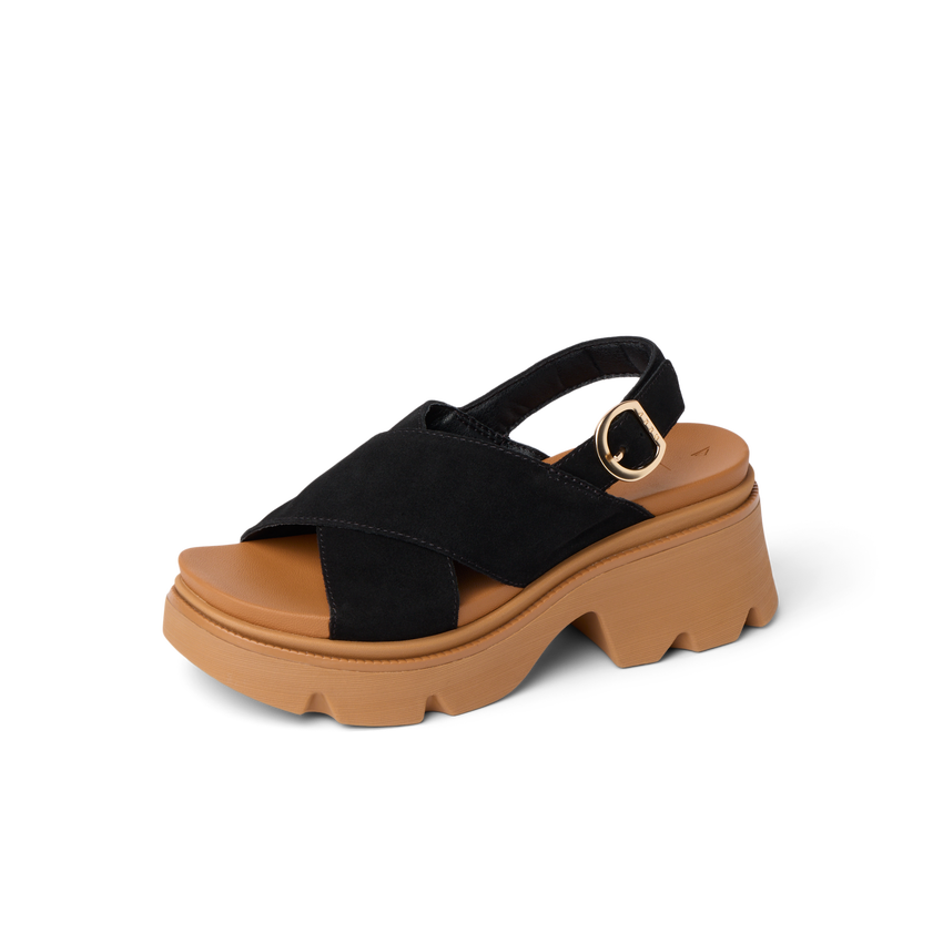 Vista Luxe Ava sandal facing right, black suede crossover strap with cushioned tan platform sole, Arch Support Styles.