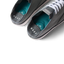 Top view close-up of Neptune Lido men's grey shoes facing upward, showing cushioned teal insoles and REEF branding.