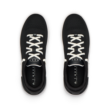 Top view of black Reef Del Mar shoes with white laces, designed for all-day comfort and beach-inspired active wear.