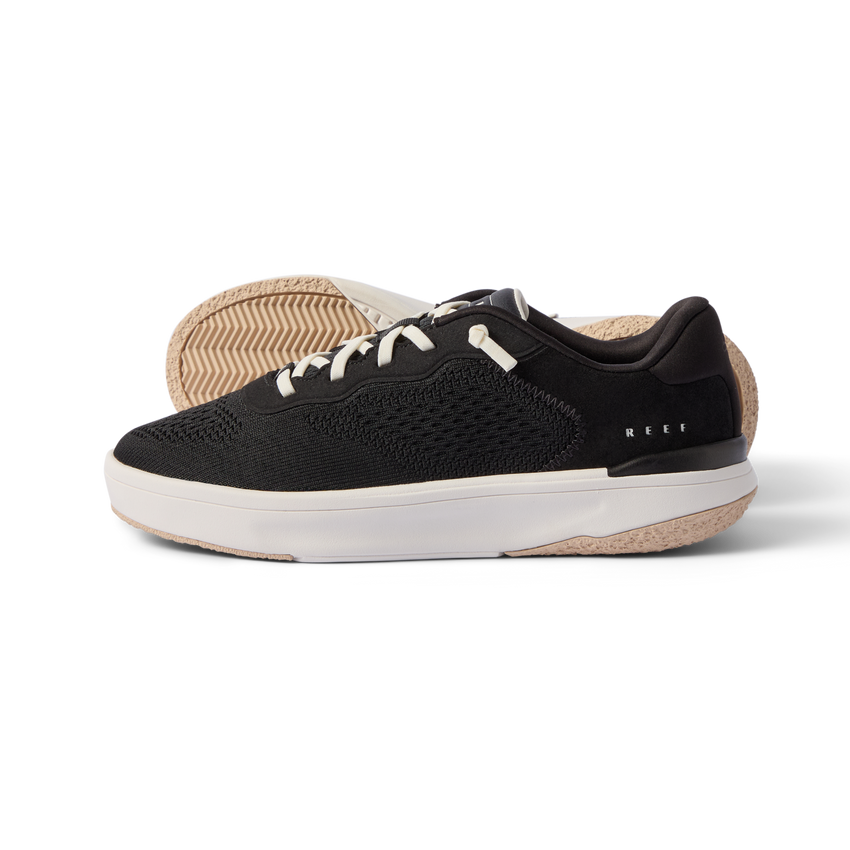 Reef Del Mar men's black sneaker facing right with cushioned sole, breathable knit, anatomical arch support, vacation-ready shoe.