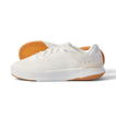 Side view of Reef Del Mar white sneaker with textured breathable upper and tan rubber sole showing grip pattern.