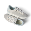 Top and side views of light grey Reef Del Mar shoes with molded footbeds and anatomical arch support, perfect for beachwear.