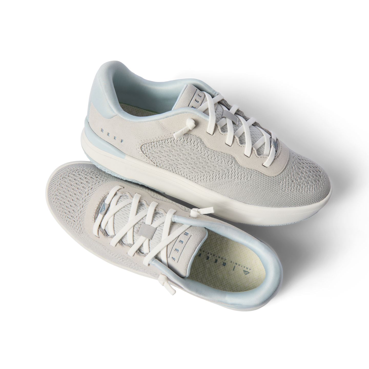 Top and side views of light grey Reef Del Mar shoes with molded footbeds and anatomical arch support, perfect for beachwear.
