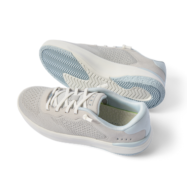 Pair of Reef Del Mar sneakers facing left showing side and outsole, breathable knit upper with soft-rebound cushioning, men's & women's shoes.