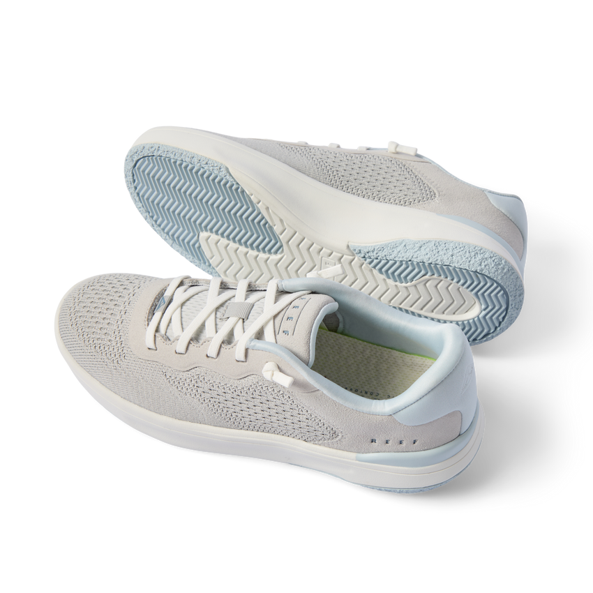 Pair of Reef Del Mar sneakers facing left showing side and outsole, breathable knit upper with soft-rebound cushioning, men's & women's shoes.