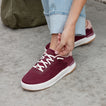 Reef Del Mar burgundy sneaker facing lower left with white laces and cushioned sole
