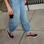 Reef Del Mar red sneakers, one facing left and one facing right, worn for comfortable everyday walking
