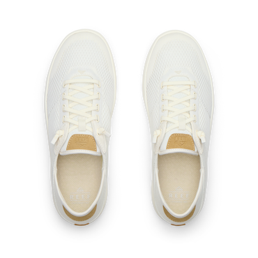Pair of Laguna shoes facing upward, showing breathable knit upper and lace detail for beach comfort.