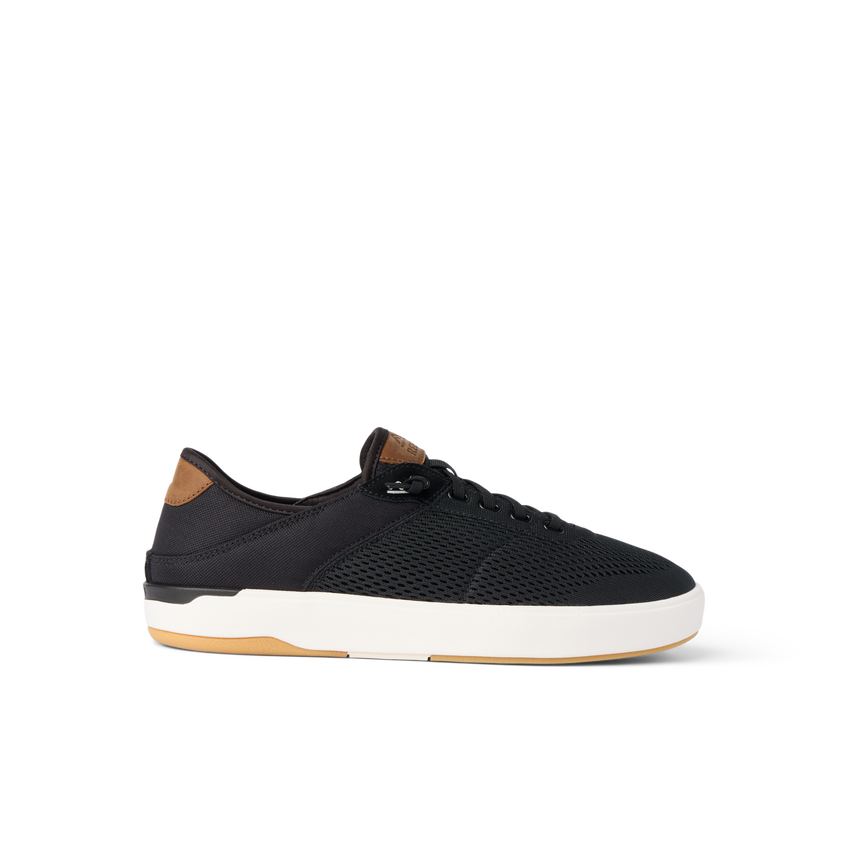 Side view of black Laguna sneaker with breathable upper, cushioned sole, and brown heel tab for beach comfort and durability