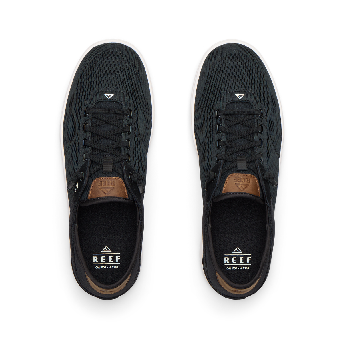 Top view of black Laguna sneakers with breathable mesh uppers, laces, and REEF branding for men’s and women’s shoes.