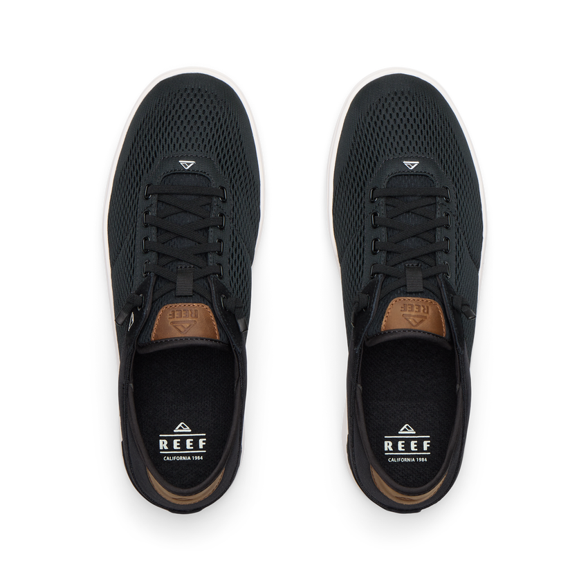 Top view of black Laguna sneakers with breathable mesh uppers, laces, and REEF branding for men’s and women’s shoes.