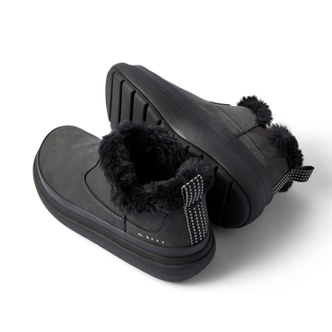 Pair of black Weekend Olivia boots, angled right, showing plush faux fur collar and durable grippy sole.