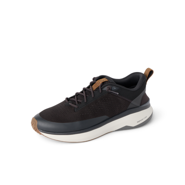 Reef Zuma black sneaker facing left with breathable knit upper, cushioned sole and flexible heel