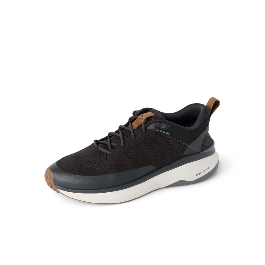 Reef Zuma black sneaker facing left with breathable knit upper, cushioned sole and flexible heel