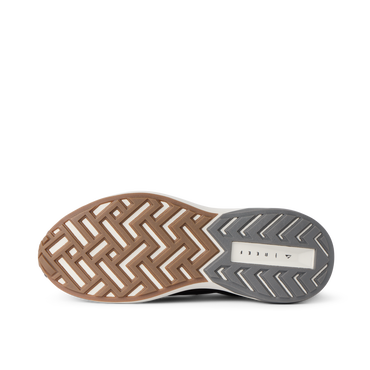 Reef Zuma sneaker outsole facing left, showing durable patterned tread and cushioned comfort design