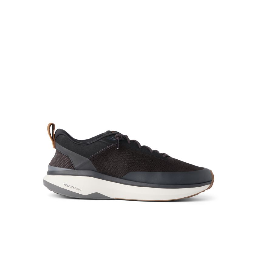Reef Zuma black knit sneaker facing right with cushioned sole and flexible heel for everyday comfort