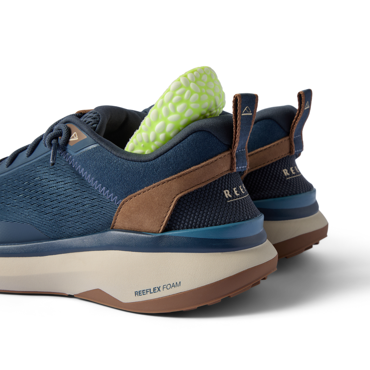 REEF Zuma sneakers facing left with cushioned heels and breathable knit uppers