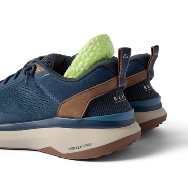 REEF Zuma sneakers facing left with cushioned heels and breathable knit uppers