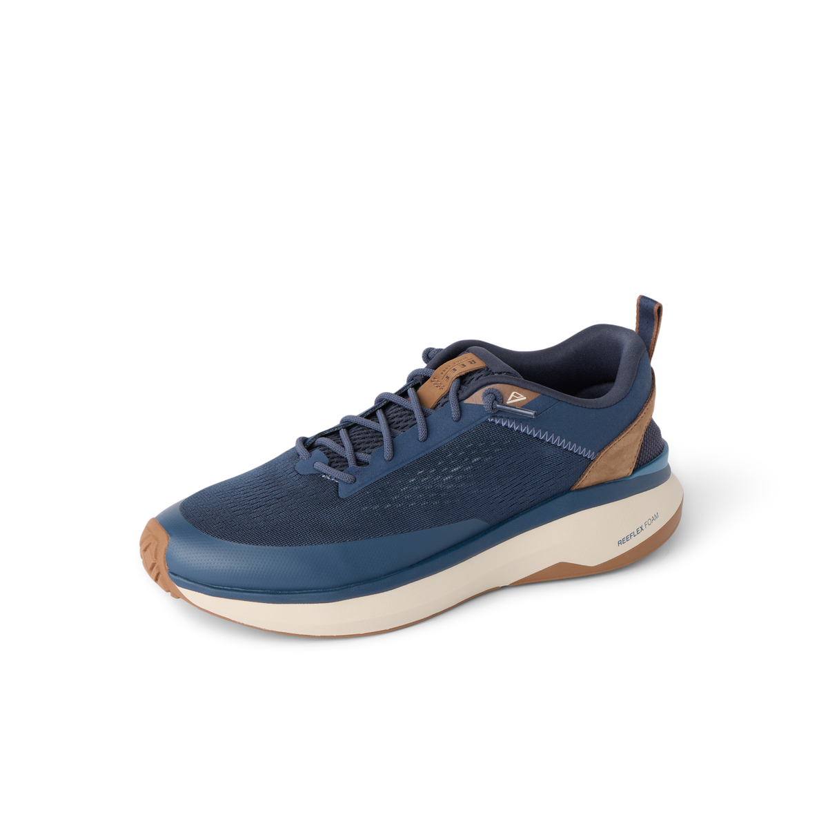 Reef Zuma navy sneaker facing left, featuring a breathable knit upper, padded collar, and cushioned sole
