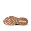 Reef Zuma sneaker close-up, outsole facing up with toe pointing left and heel right, showing textured tread and cushioned sole