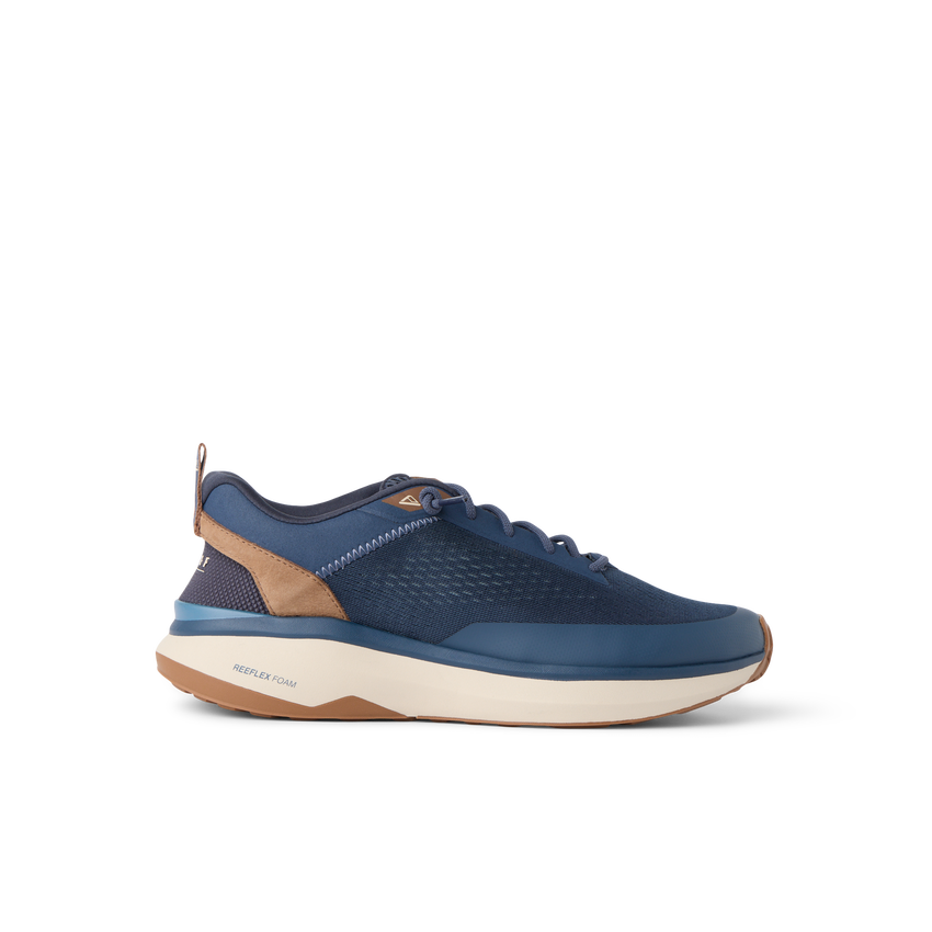 Reef Zuma blue sneaker facing right with breathable knit upper, cushioned sole, and flexible heel