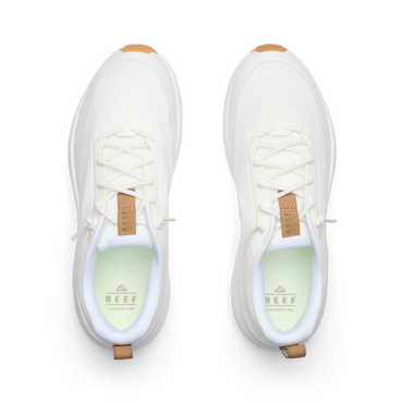 Reef Zuma white sneakers facing forward from a top view with breathable knit uppers and cushioned footbeds