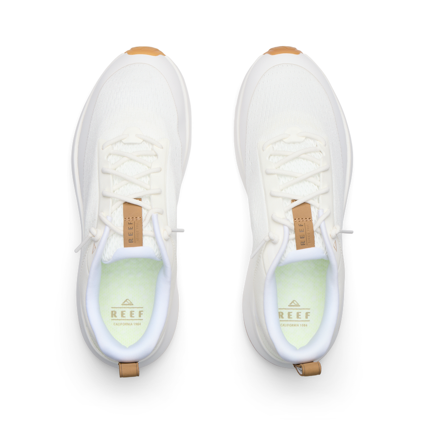 Reef Zuma white sneakers facing forward from a top view with breathable knit uppers and cushioned footbeds