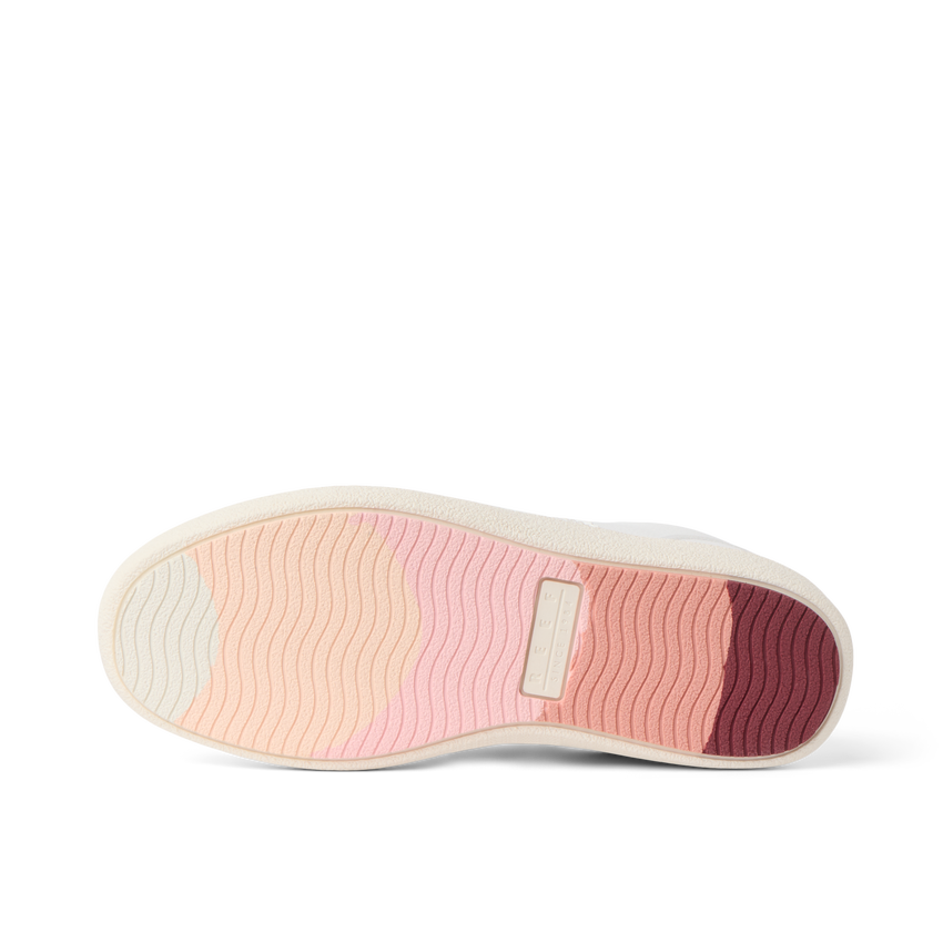 REEF Kickback shoe sole viewed from below with toe pointing left and cushioned wavy footbed
