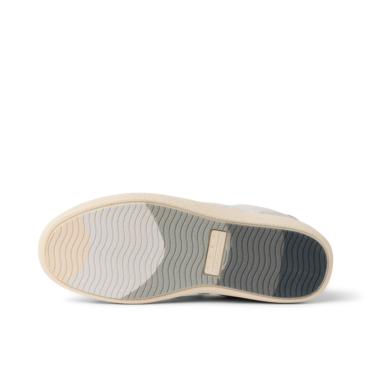 REEF Kickback sneaker outsole facing upward with toe pointing left showing textured tread for everyday comfort