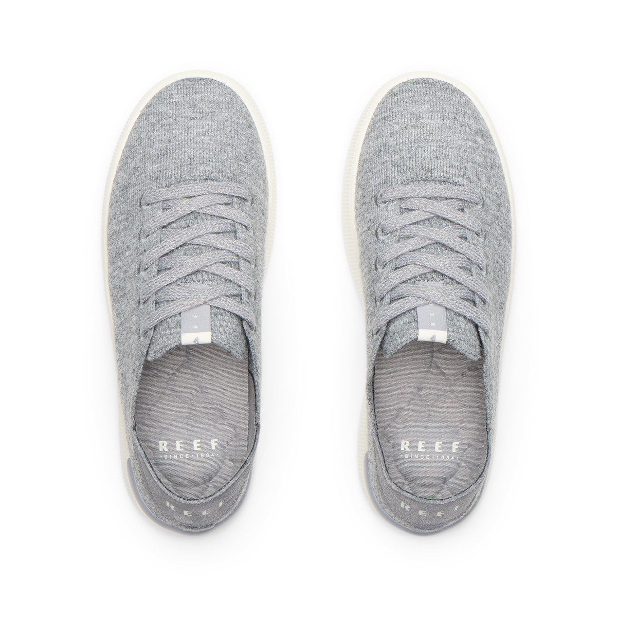 Reef Neptune gray knit shoes, toes facing upward, shown from above with cushioned footbeds and collapsible heels