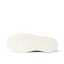 White footwear sole viewed from below, facing left, with textured traction grooves and a cushioned footbed pattern