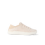 Cream lace up sneaker facing right on a black background