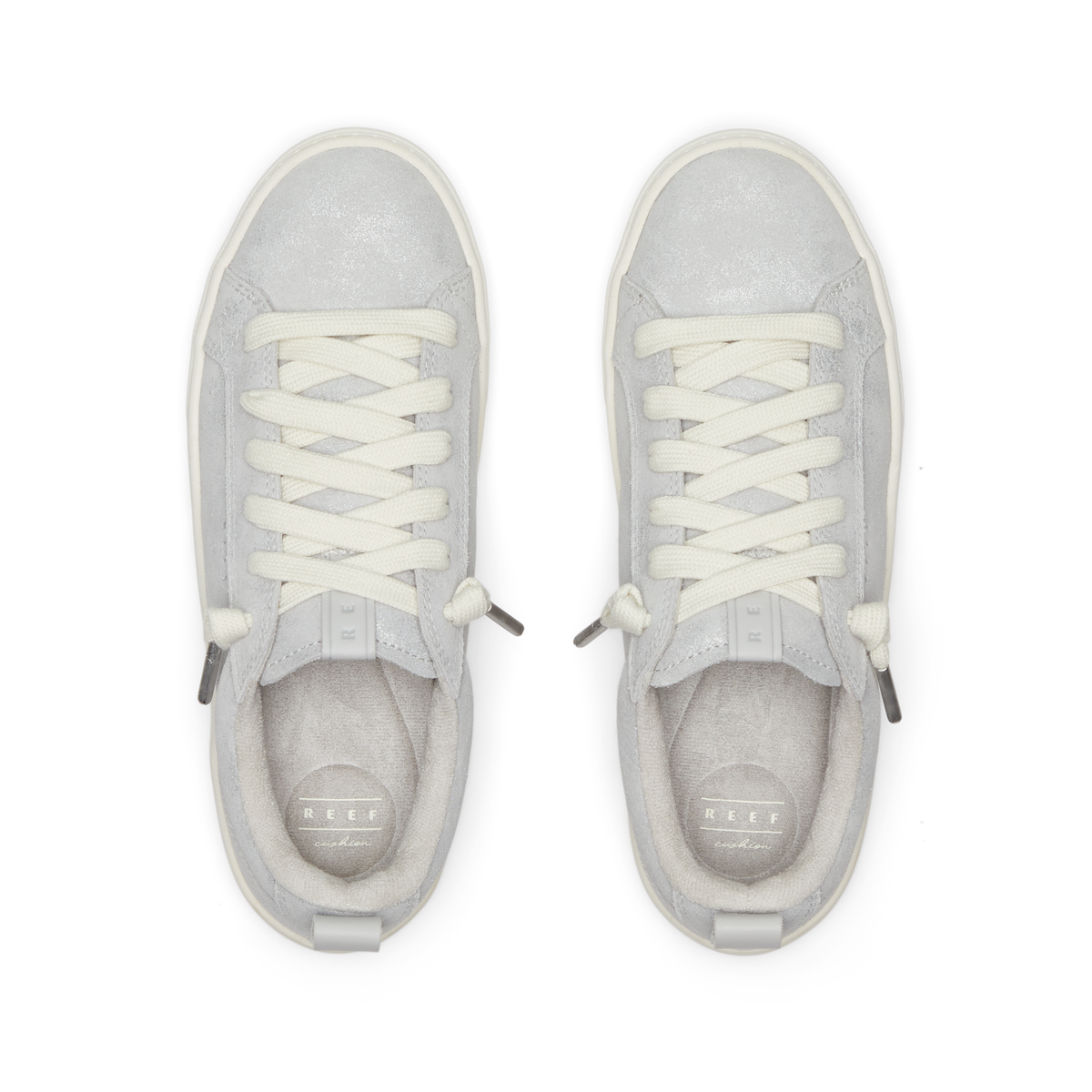 Pair of white REEF lace up sneakers facing upward, viewed from above