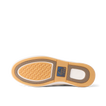Bottom sole of a REEF shoe facing upward showing tread pattern and logo in tan, brown, and white colors.