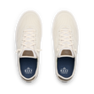 Top view of pair of cream-colored REEF sneakers facing upward with mesh uppers and blue cushioned insoles.