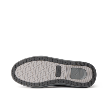 Del Mar Commuter shoe sole viewed from below, toe pointing left, with textured tread and durable rubber outsole
