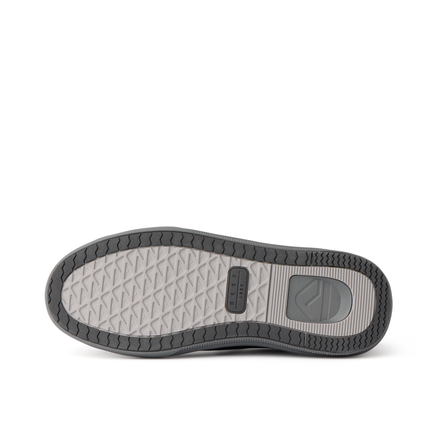 Del Mar Commuter shoe sole viewed from below, toe pointing left, with textured tread and durable rubber outsole