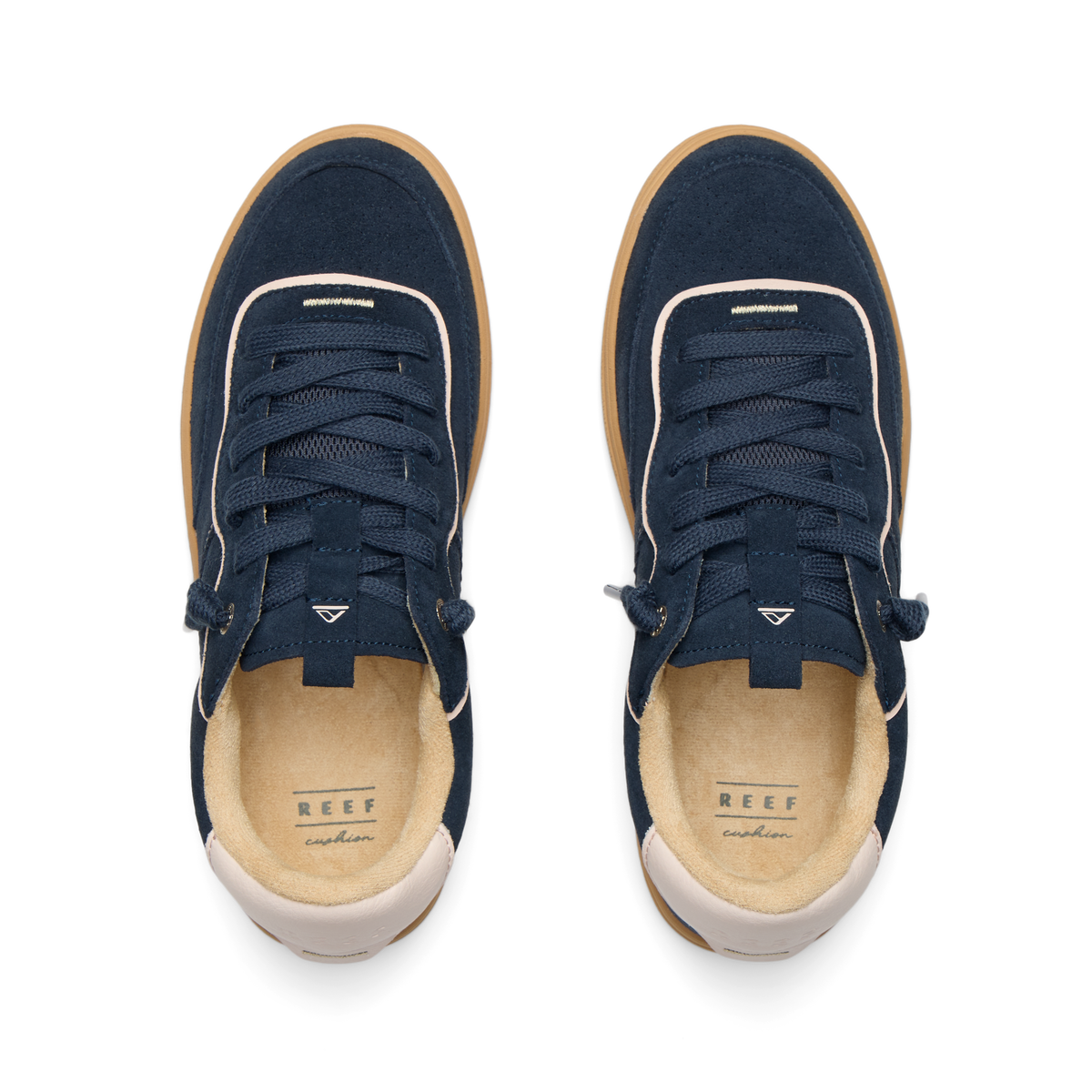 REEF Kickback sneakers viewed from above with toes facing upward and cushioned footbeds visible