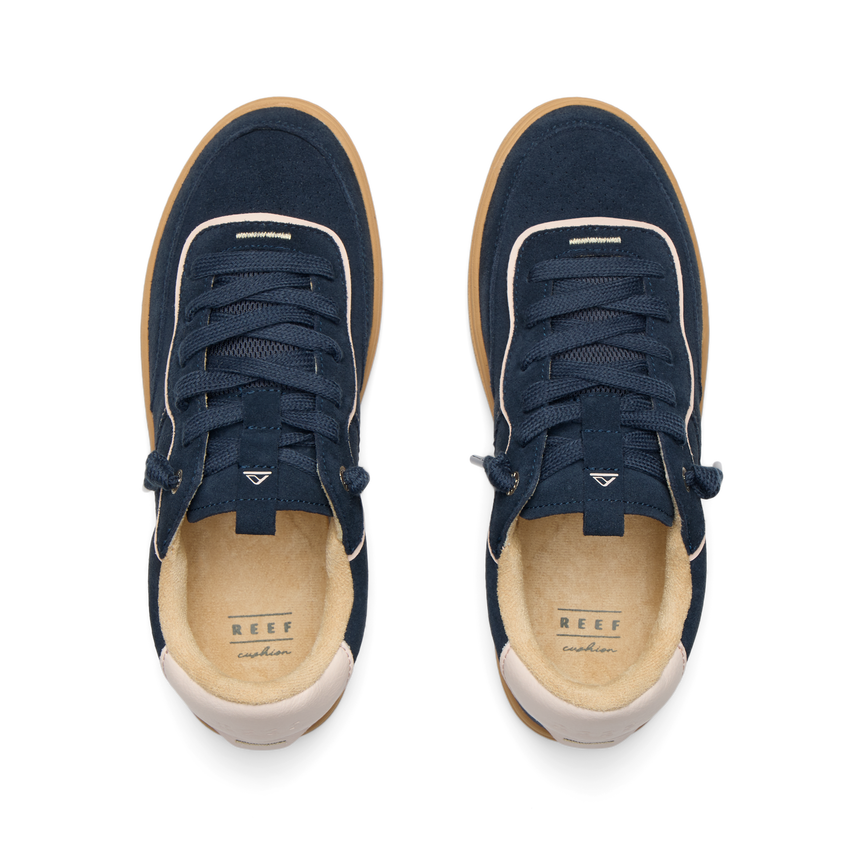 REEF Kickback sneakers viewed from above with toes facing upward and cushioned footbeds visible