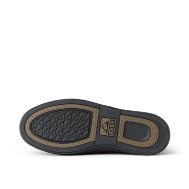 Del Mar Desert outsole facing upward in a close up, showing textured tread and REEF logo