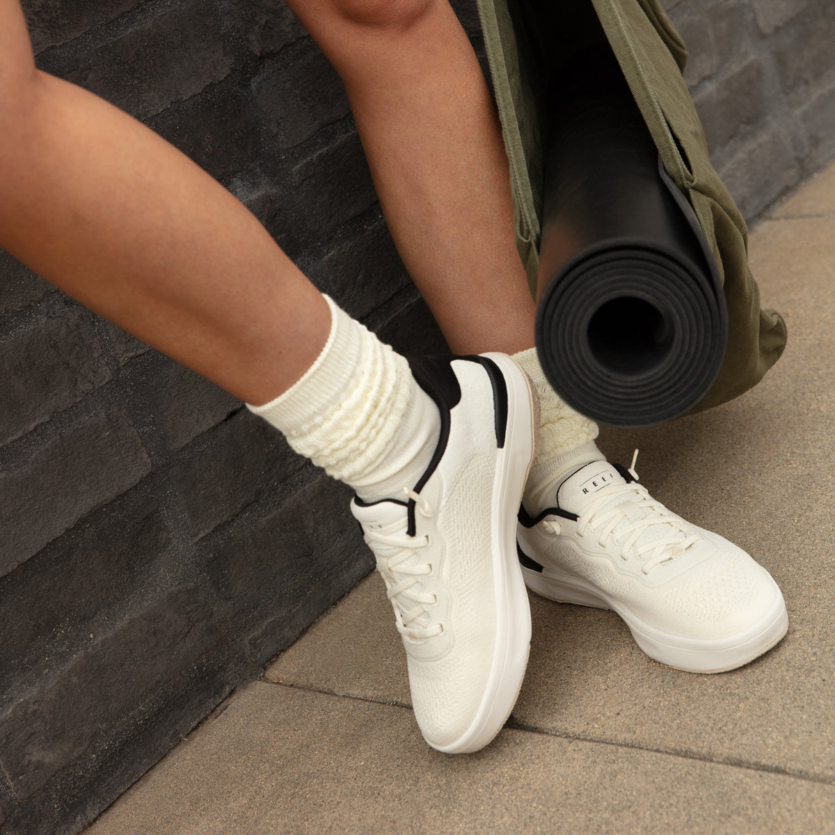 Reef Del Mar white sneakers facing right with cushioned comfort for everyday walking