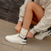 Reef Del Mar white sneaker facing left with cushioned comfort for everyday walking