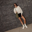 Reef Del Mar white sneakers with toes facing forward, offering lightweight comfort for everyday walking