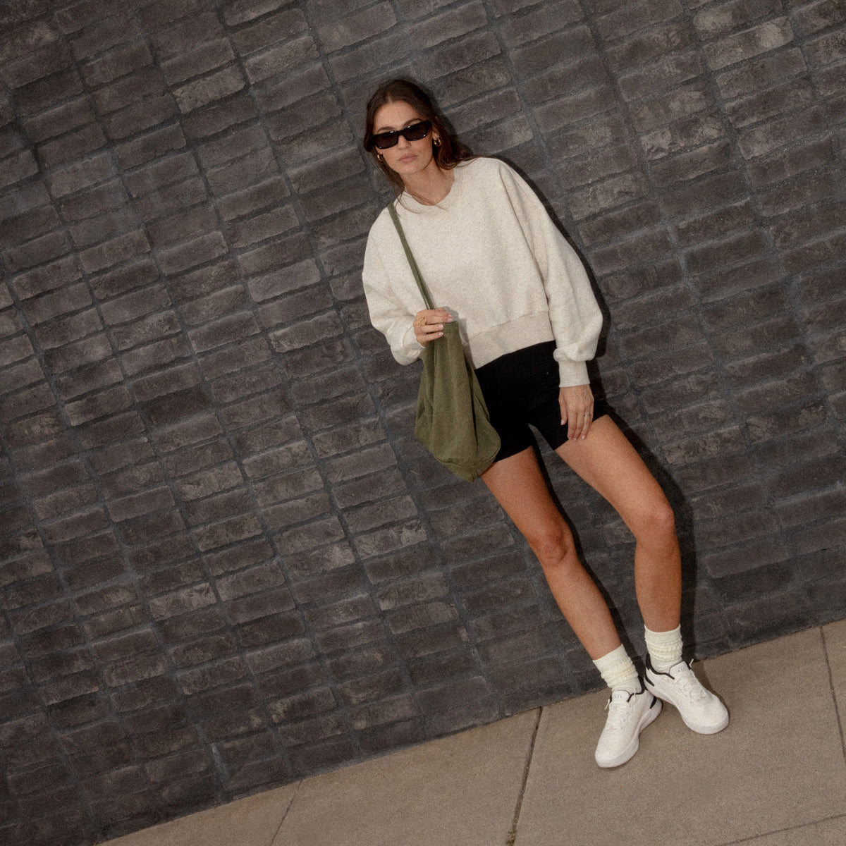 Reef Del Mar white sneakers with toes facing forward, offering lightweight comfort for everyday walking